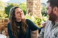 Happy, love and couple on a patio, smile and relax, laughing and bonding with joke and conversation outside. Family Royalty Free Stock Photo