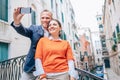 Happy in love couple take selfie photo on one of numerous bridges in Venice Royalty Free Stock Photo