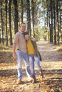 Happy love couple walking in forest and embracing, young family portrait, casual wear Royalty Free Stock Photo