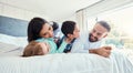 Happy, love and family being playful on the bed together in the bedroom of their modern house. Happiness, excited and Royalty Free Stock Photo