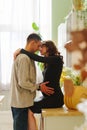 happy and in love man and pregnant woman in black dress. Royalty Free Stock Photo