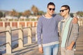 Happy, love and queer male couple on walk, promenade and outside for exercise on holiday. LGBT, marriage and affection Royalty Free Stock Photo