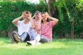 Happy lovely beautiful Asian family father, mother and son playing together at home garden. Smiling parent and cheerful kid relax Royalty Free Stock Photo