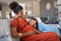 Happy lovely daughter hugging pregnant mother Royalty Free Stock Photo