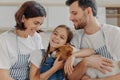 Happy lovely family smile and express sincere emotions, enjoy spending time together at cozy home. Smiling little child glad Royalty Free Stock Photo