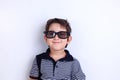 Happy lovely smiling boy in sunglasses, studio shoot on white. C Royalty Free Stock Photo