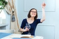 Happy lovely woman sitting and calling for waitress in cafe Royalty Free Stock Photo