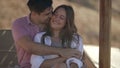 happy lovers on beach, man is hugging young beautiful woman, happy summer weekend