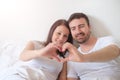 Happy lovers couple feeling comfortable lying in bed Royalty Free Stock Photo