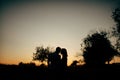 Happy lovers have a romantic time on sunset Royalty Free Stock Photo