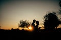 Happy lovers have a romantic time on sunset Royalty Free Stock Photo