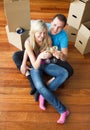 Happy lovers moving house and drinking champagne Royalty Free Stock Photo