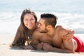 Happy lovers resting on sandy beach Royalty Free Stock Photo