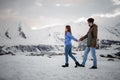 Happy lovers on the winter vacations spending time in mountains Royalty Free Stock Photo