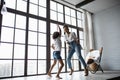 Happy loving afro american family. Young mother and her daughter playing in the nursery. Mom and daughter are dancing on the