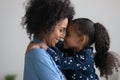 Happy loving Afro American mother holding cute daughter in arms Royalty Free Stock Photo