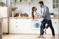 Happy loving couple dancing romantic dance on date in kitchen Royalty Free Stock Photo