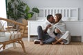 Happy loving couple drinking cocoa on winter morning in bed Royalty Free Stock Photo