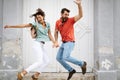 Happy loving couple having fun and jumping with joy outdoor Royalty Free Stock Photo