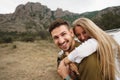 Happy loving couple hiking and hugging in mountains Royalty Free Stock Photo