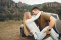 Happy loving couple hiking and hugging in mountains Royalty Free Stock Photo