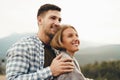 Happy loving couple hiking and hugging in mountains Royalty Free Stock Photo