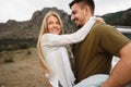 Happy loving couple hiking and hugging in mountains Royalty Free Stock Photo