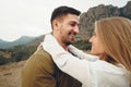 Happy loving couple hiking and hugging in mountains Royalty Free Stock Photo