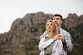 Happy loving couple hiking and hugging in mountains Royalty Free Stock Photo