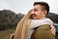 Happy loving couple hiking and hugging in mountains Royalty Free Stock Photo