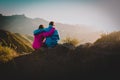 Happy loving couple hiking in mountains, family travel in nature Royalty Free Stock Photo