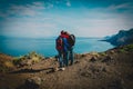 Happy loving couple hiking in mountains at sea Royalty Free Stock Photo