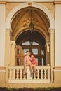 Happy loving couple kissing and sitting outside at balcony of the Odessa Opera House