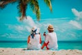 Happy loving couple relax with wine on tropical beach Royalty Free Stock Photo