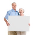 Happy loving couple with sign Royalty Free Stock Photo