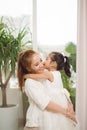 Happy loving family.Asian mother and child girl playing, kissing and hugging Royalty Free Stock Photo