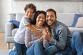 Happy Loving Family. Cheerful African American parents and son posing for photo at home Royalty Free Stock Photo