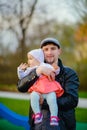 Happy loving family. Father and his daughter child girl playing and hugging outdoors. Cute little girl hugs daddy. Concept of Royalty Free Stock Photo