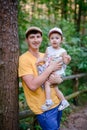 Happy loving family. Father and his daughter child girl playing and hugging outdoors. Cute little girl hugs daddy. Concept of Royalty Free Stock Photo