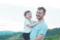 Happy loving family. Father and his son baby boy playing and hugging outdoors. Royalty Free Stock Photo