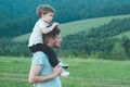 Happy loving family. Father and his son baby boy playing and hugging outdoors. Royalty Free Stock Photo