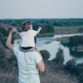 Loving family. Father and his son baby boy playing and hugging outdoors. Happy dad and son outdoors. Concept of Father`s day. Royalty Free Stock Photo