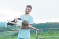 Happy loving family. Father and his son baby boy playing and hugging outdoors. Royalty Free Stock Photo