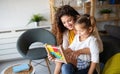 Happy loving family. Beautiful mother and child girl playing, kissing and hugging Royalty Free Stock Photo