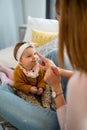 Happy loving family. Mother and child girl playing, kissing and hugging Royalty Free Stock Photo