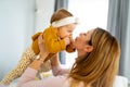 Happy loving family. Mother and child girl playing, kissing and hugging Royalty Free Stock Photo