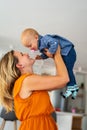 Happy loving family. Mother and child girl playing, kissing and hugging Royalty Free Stock Photo