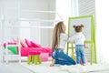 Happy loving family. Mother and daughter in the children`s room. Cute little girl is playing with a woman. Royalty Free Stock Photo