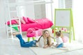 Happy loving family. Mother and daughter in the children`s room. Cute little girl is playing with a woman. Royalty Free Stock Photo