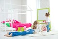 Happy loving family. Mother and daughter in the children`s room. Cute little girl is playing with a woman. Royalty Free Stock Photo